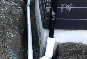 underground downspout damage repair and maintenance