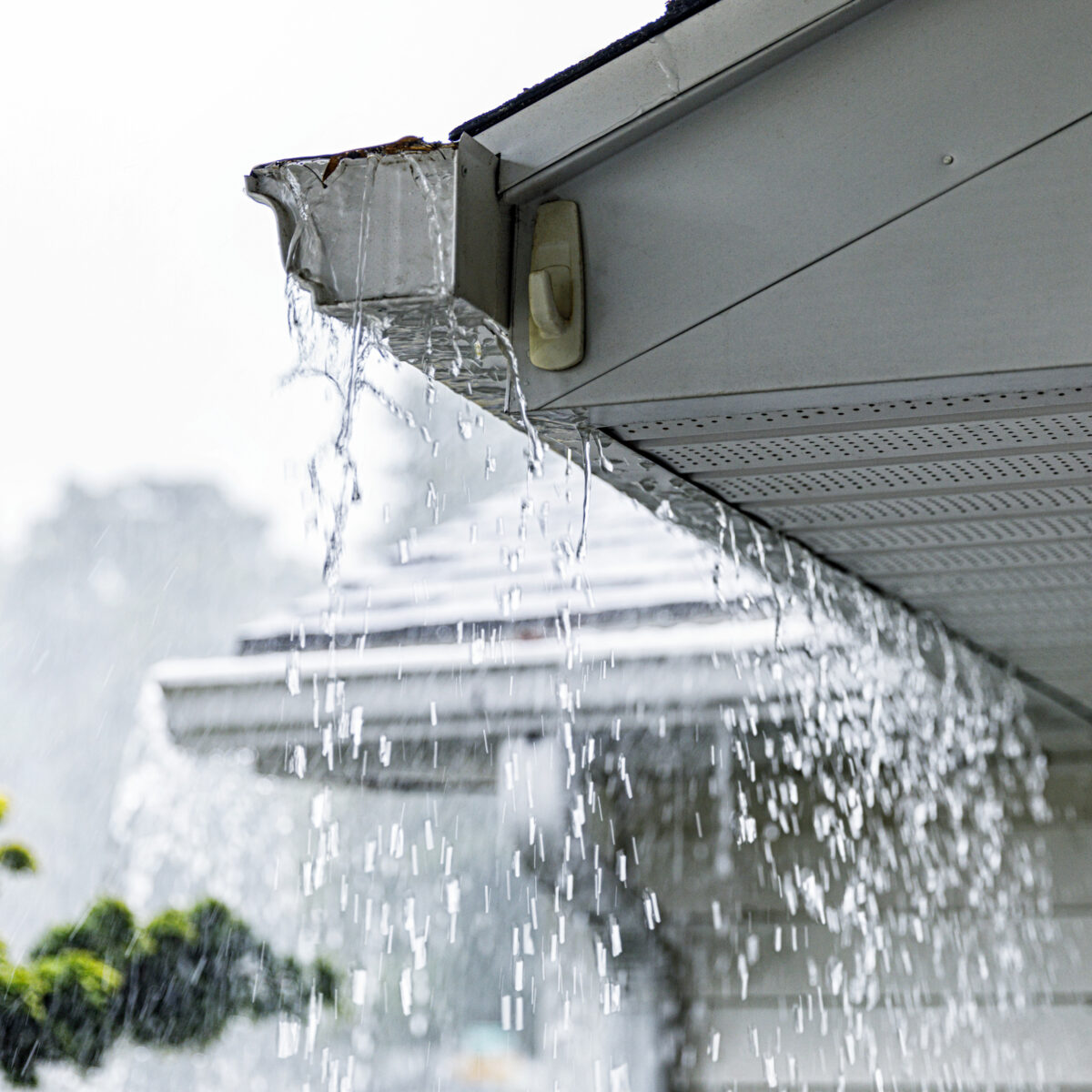 roof gutter overflowing with rain water