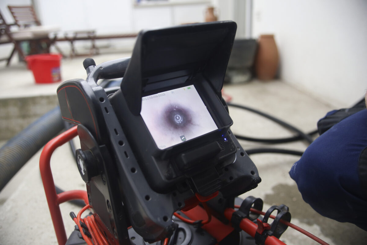 sewer scope camera inspection pipe blockage detector in garage